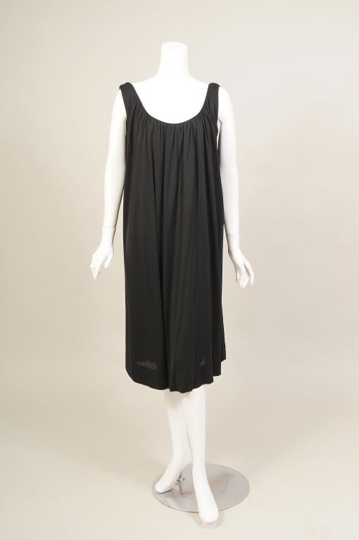 So stylish and chic, a simple black silk jersey dress designed by Walter Bass for JAX, the legendary 1970's Los Angeles boutique.  The dress is sleeveless with a scoop neckline.  The fabric is gathered at the neckline and falls in loose folds.  The