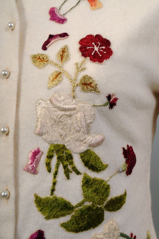 Another masterpiece from the workroom of Helen Bond Carruthers in Versailles, Kentucky. This cream colored cashmere sweater is lavishly embroidered with multi color hand worked appliques.<br />
The basic cashmere sweater has been fitted, hemmed and
