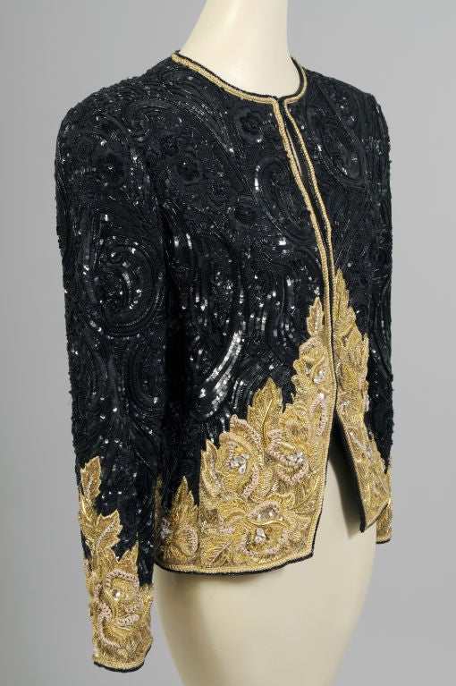 The beadwork and embroidery on this jacket is truly amazing!  It is completely covered with sequins, bugle beads, caviar beads, silk floss embroidery, prong set rhinestones and gold metallic embroidery in several different weights and colors of