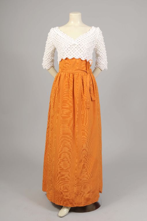 Sybil Connolly is the noted Irish Couturier. Jacqueline Kennedy wore one of her designs for her official White House portrait. Her work is exquisite, and she often used fabrics and laces from her native Ireland for her couture designs.  This two