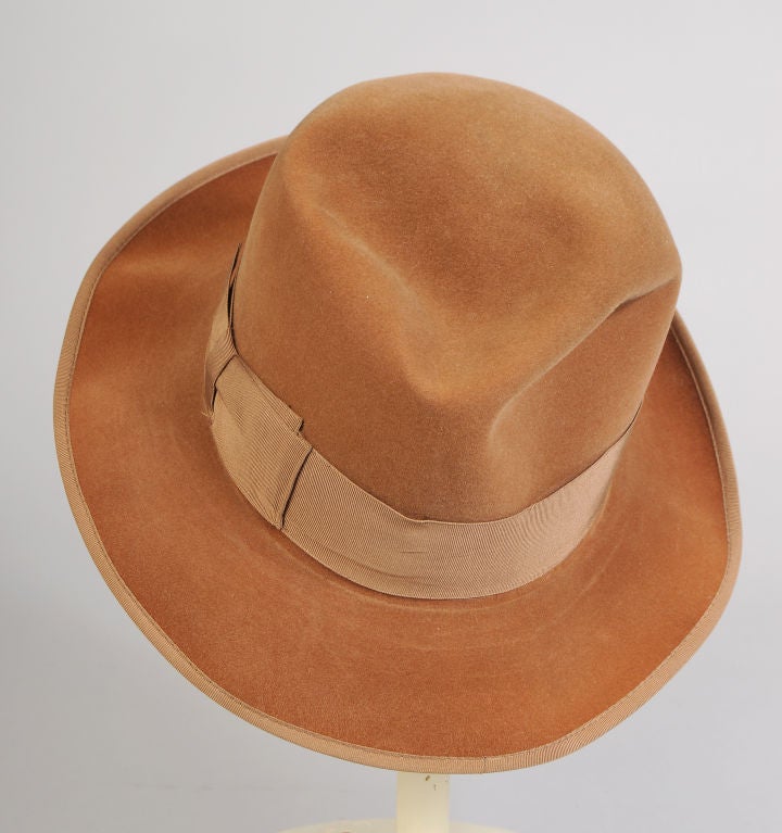 The best of the best, vintage Borsalino fedoras are iconic.  This vicuna colored wool felt hat is trimmed with a matching grosgrain ribbon hat band.  The interior has a wide leather band, bearing the name of Schettini, Milano, the exclusive retailer