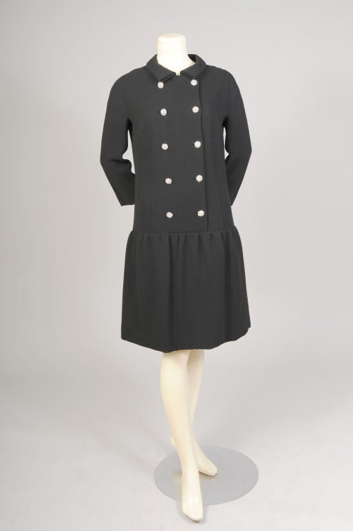 I am always amazed at the luxurious quality of the clothes designed by Norman Norell.  This chic little dinner dress is as beautiful on the inside as the it is on the right side. The double breasted dress has a round collar, long sleeves, and ten