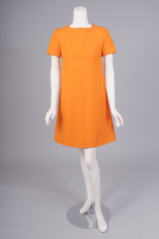 A great dress designed by an icon of French style for an icon of American design. Andre Courreges designed this brilliant orange dress for Florence Knoll in the 1960's.<br />
It carries the Haute Couture label with the numbered tape underneath, as