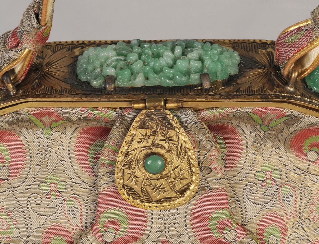 An exquisite Persian inspired brocade bag from the 1950's is embellished with carved 