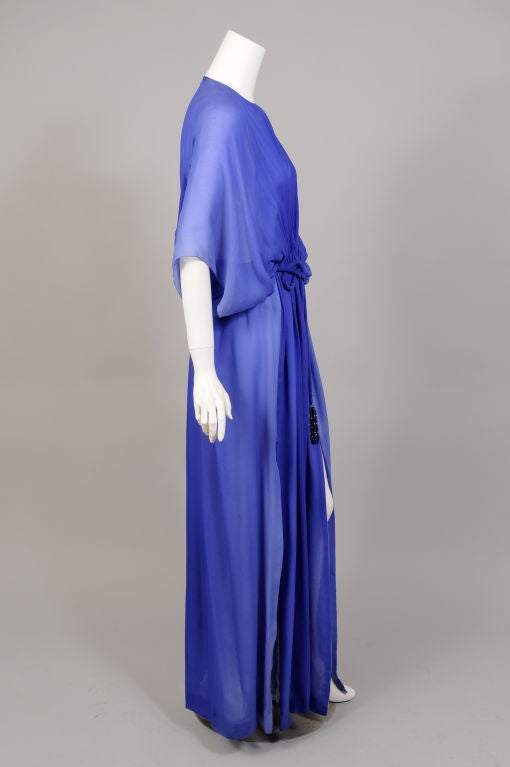 This Pauline Trigere dress is so evocative of the simple elegance of the 1970's. Just two layers of chiffon are all there is between you and the world.  A round neckline, full cut sleeves, an elasticized waistline with a jewel trimmed fabric belt,