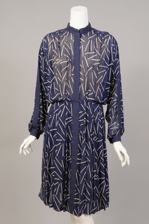 It is just amazing that this 5 piece ensemble created, in 1975 by Pauline Trigere, remains together after all this time. A cheerful blue and white silk chiffon is combined with a blue wool for all of the pieces. The coat is 7/8 length and made from