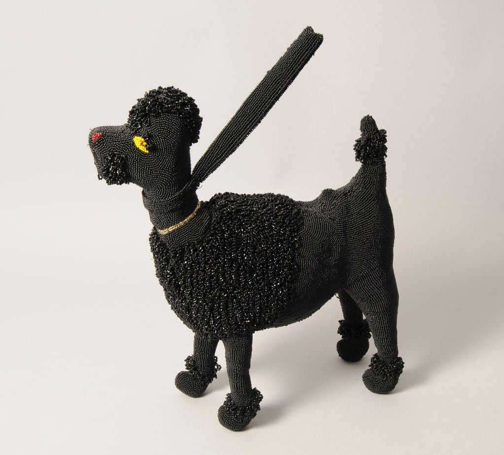 French poodles were all the rage in the 1950's. Their likeness was reproduced in jewelry, on sweaters, on the famous poodle skirt and the Walborg poodle handbag. This is the most difficult of all the items to find.
The bag is all handmade in