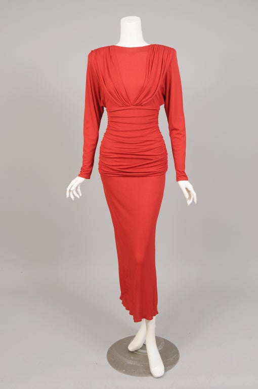 Roland Klein began working under marc Bohan at Dior in the early 1960's, he then worked as Karl Lagerfeld's assistant at Patou. In 1979 he opened his own firm in London and this sexy red dress must be one of his early pieces. The dress is made from