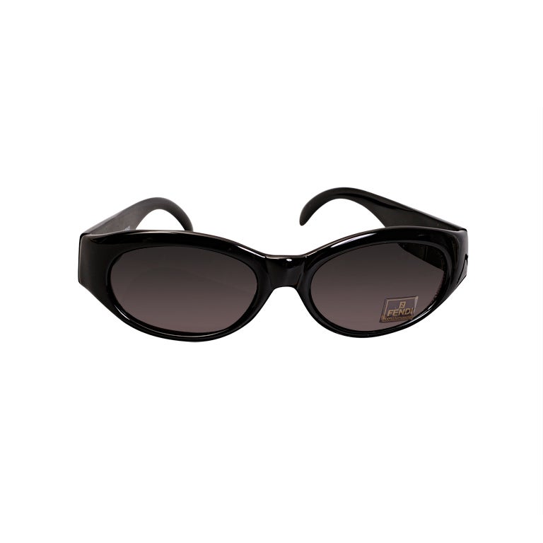 A pristine pair of Fendi sunglasses comes in the original Fendi logo case. The black framed glasses still retain all of their original tags. The case is in pristine condition.
Measurements;
Width 6