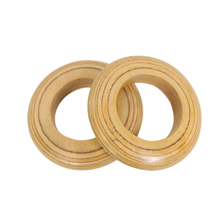 This fabulous pair of statement bangle bracelets is made from a very pale wood with darker rings adding interest to the design. They are in excellent condition.

Measurements;
Width 5"
Opening 2 1/2"
Interior circumference 7