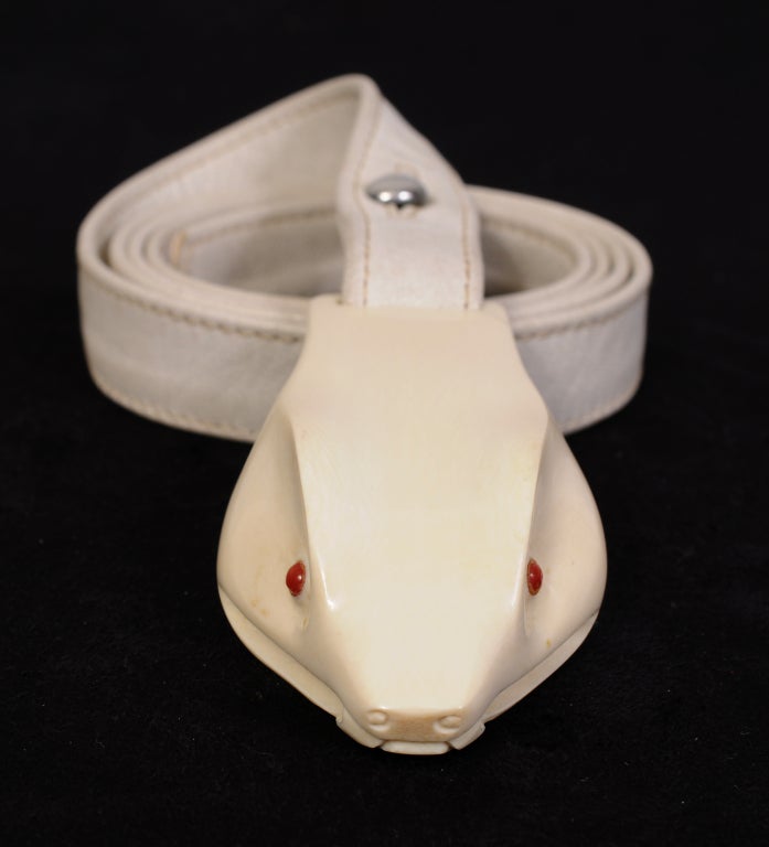 Deigned by Elsa Peretti for Halston in the mid 1970's this striking and rare pre-ban ivory snake head buckle was retailed by Tiffany & Co. This design has since been discontinued by Tiffany & Co. The life like snake head has red eyes and an open