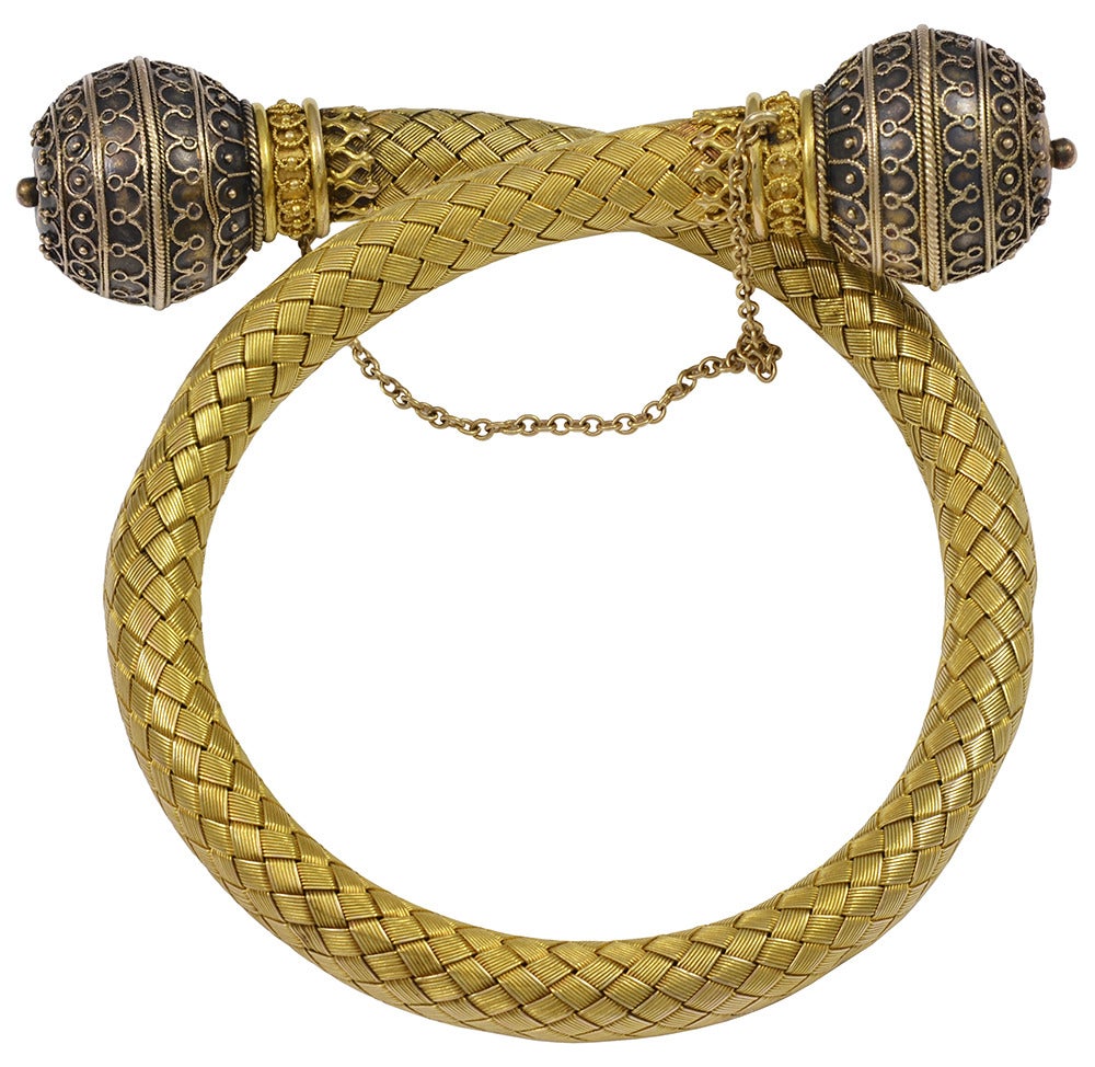 A wonderfully crafted Victorian Era flexible gold cuff bracelet.  The gold is interwoven to give a very soft and comfortable feel to it, with great artistry on each end of the bracelet.  All made in 18k yellow gold.