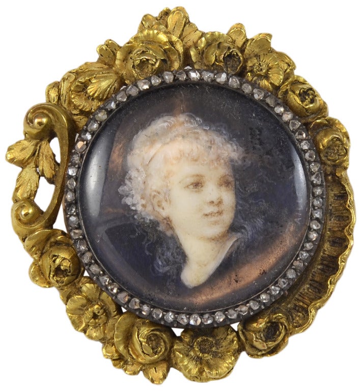 This is a beautiful hand painted porcelain portrait brooch created by Fernand Paillet, for the Frederic Boucheron.  The portrait is surrounded by rose cut diamonds set in 18k yellow gold.

Fernand Paillet (1850-1918), painted miniature portraits