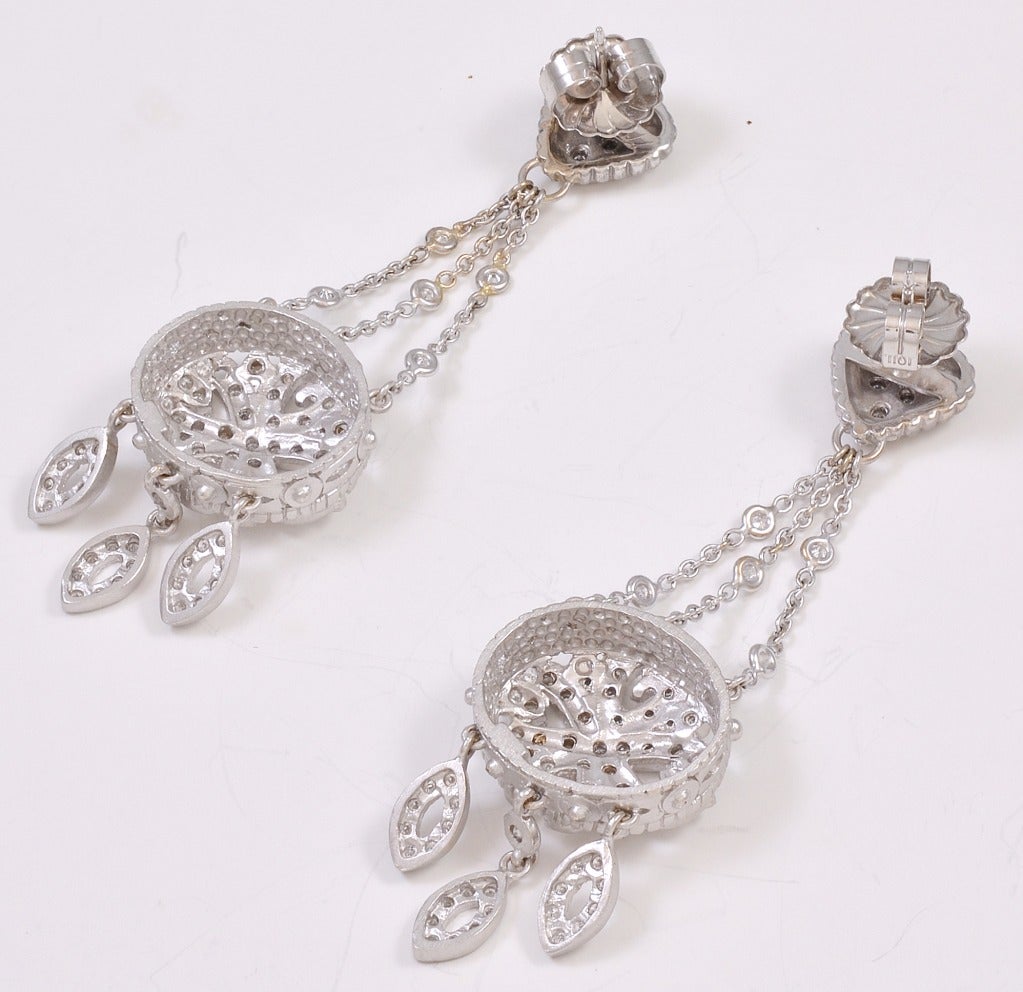 A show stopping pair of Doris Panos round brilliant diamond chandelier earrings set in 18kt white gold.  The estimated total weight of the diamonds is 2.25cts.  Signed 