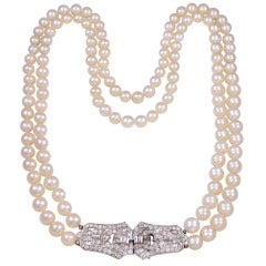 Antique Double Strand of Nesting Pearls with a Diamond Platinum Clasp