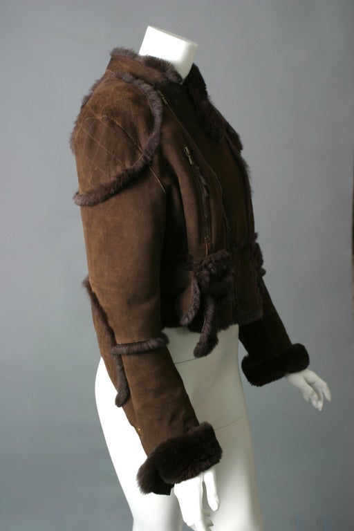 Christian Dior, boutique, circa 2004

Chocolate Orylag fur jacket, as soft as Chinchila fur...
Decorative zips, quilting to the elbows and shoulders, zip fastening centre front, tightening buckles on the back and sides, Dior buttons to the