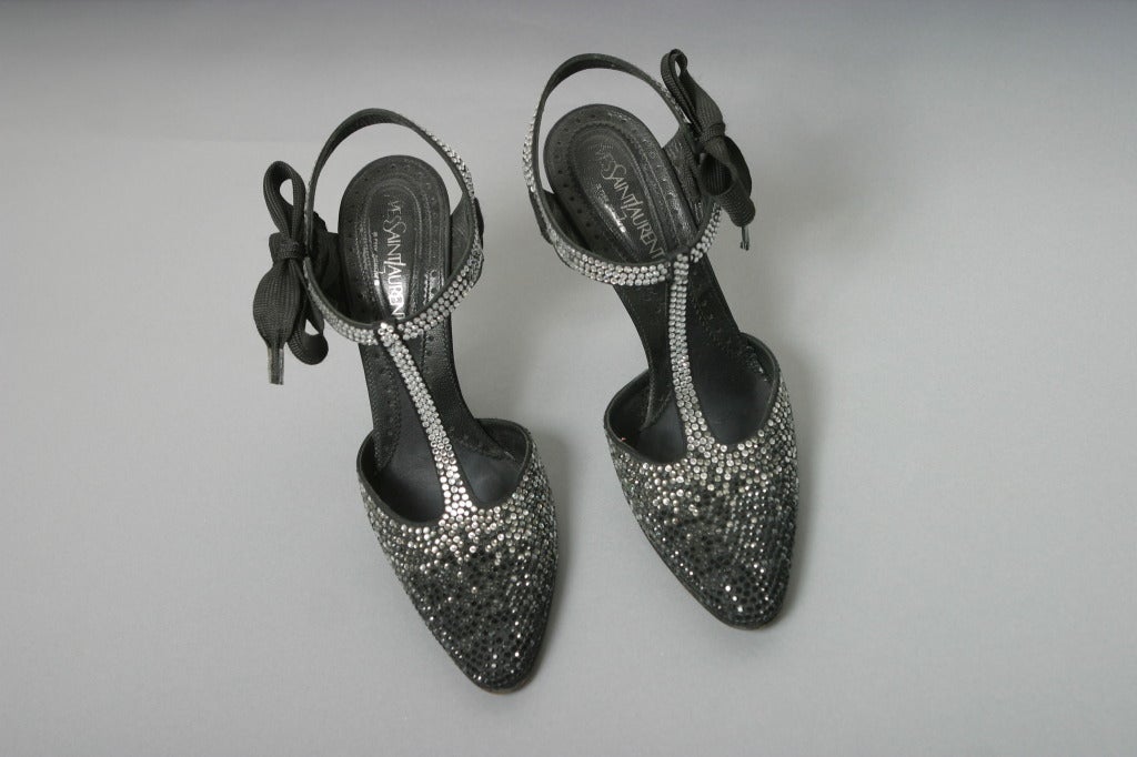 Yves Saint Laurent, by TOM FORD, Paris, Fall 2003

Collector extremely rare top of the range, round toe ,black satin evening  sandals, completely covered, heel as well, in Swarovski crystals, shaded black to natural white, closing with a ribbon on