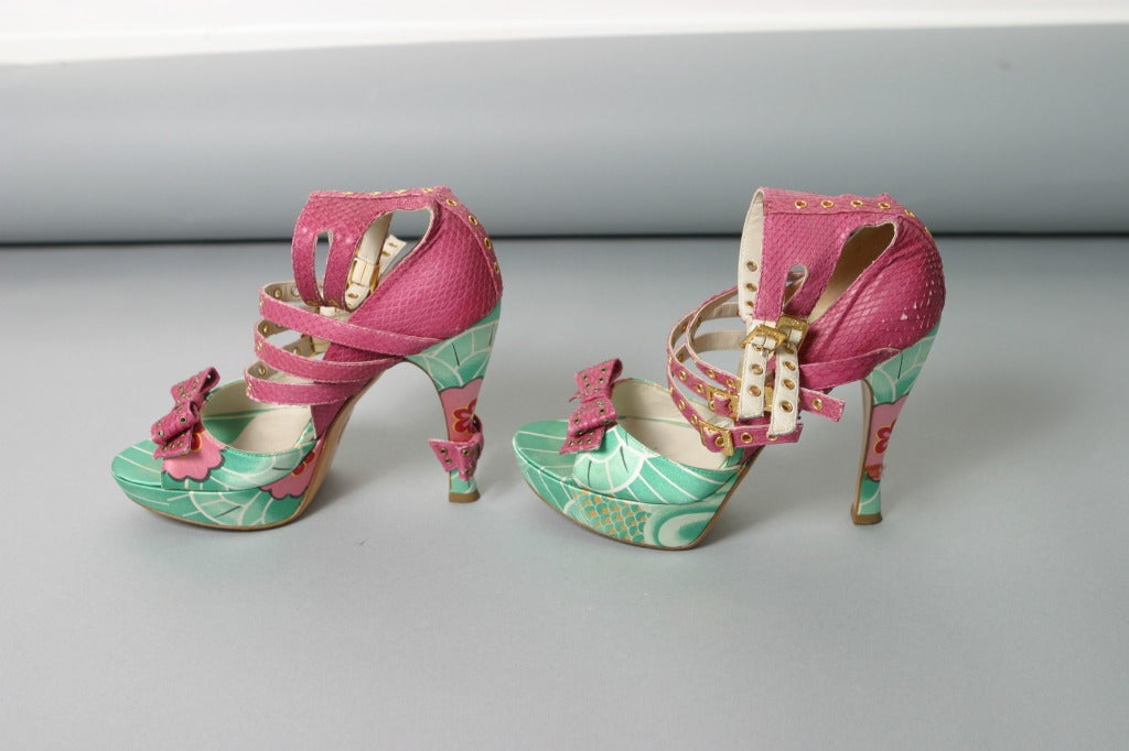 Christian DIOR, Paris, Fall 2003
Iconic crazy shoes, partly hot pink python and  partly printed green silk satin ( platform , front and heel)
Inner sole of pink python, stamped silver.
Classic nude leather soles.

Marked size : 38 1/2
Approx.