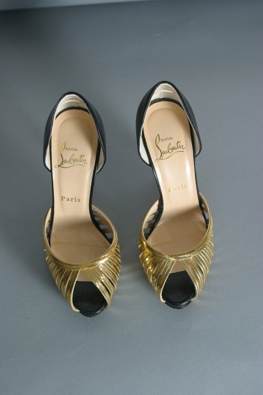 CHRISTIAN LOUBOUTIN Gold metallic and black calfskin pumps Size 37 1/2