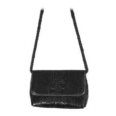 Retro 1985s Chanel micro sequined pouch on silk braid