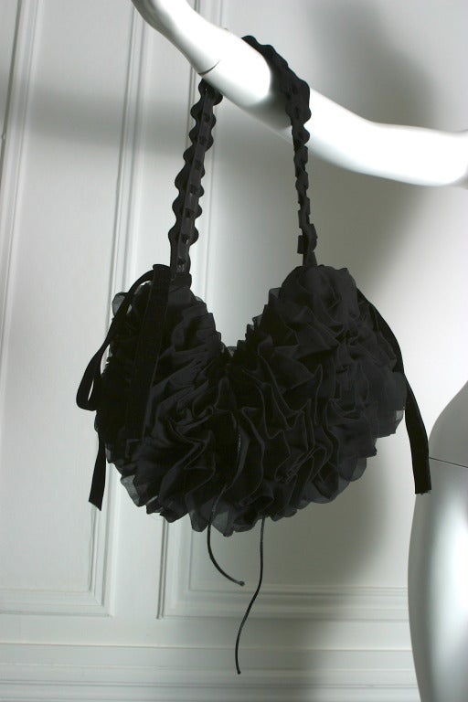 Yves Saint- Laurent, by Tom Ford, Fall 2003

Gorgeous boudoir pleated black chiffon and velvet evening hand bag, the inside lined in black silk satin, it is held closed by a black ribbon.
Gold stamp on the inside '' Yves Saint- Laurent--- rive