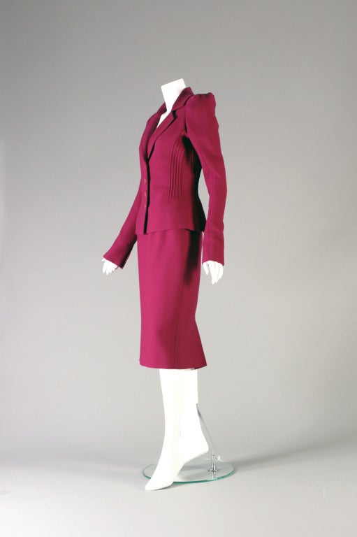 Christian DIOR, by john GALLIANO, haute couture, circa 2000

A glamorous Raspberry wool crepe skirt suit, labelled and marked  (both on the skirt and jacket) '' Christian DIOR - haute couture-  Paris''. White label, black script.
The tight fitted