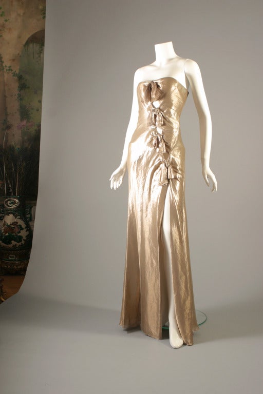 Christian DIOR, ready to wear, by John GALLIANO, spring- summer 2003

This is the same golden lamé bustier evening sheath as the one worn by Laeticia Casta at the 2003 Cannes film festival, it is actually at the Dior museum in Grandville, France,