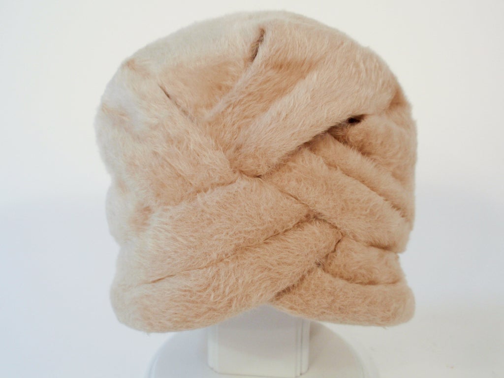 This lovely vintage turban hat is a Saks 5th Ave licensed reproduction of a Jeanne Lanvin design by Castillo. It is made of a soft and furry wool felt.

Measurements: 
6