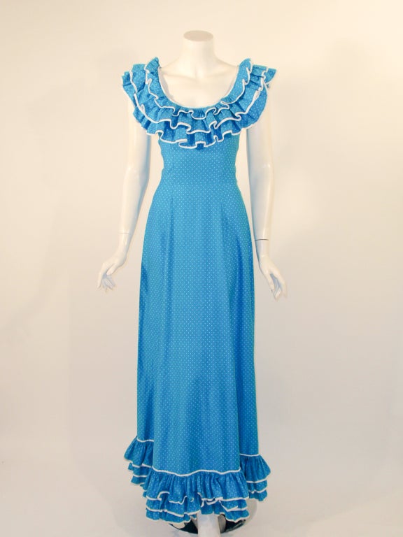 This is a darling long dress, made by Alexander's adaptation of original by Yves Saint Laurent. It is made of a blue with white pols dot polished cotton, and has ruffles at the neck and the hem.

Size 9/10 US (circa 1970s)

Measurements: