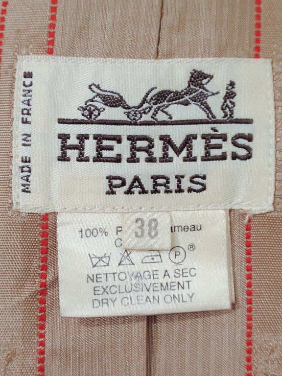 This is a fantastically soft car coat from Hermes. It is made of 100% Camel Hair. There are gold tone metal and leather toggles on the front closure. Great over-size style and great for cold weather.

Measurements: 

Size 38 FR, 8 US

Bust: