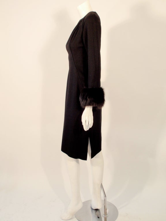 black dress with fur cuffs