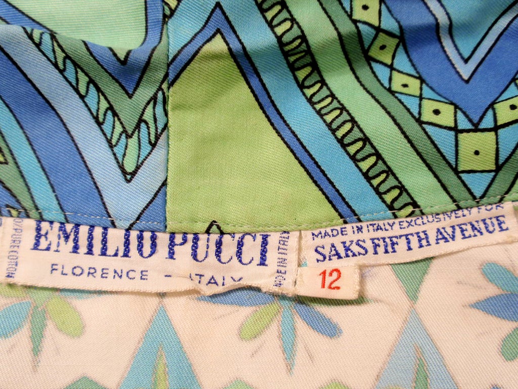 Made exclusively for Saks Fifth Avenue by Emilio Pucci Italy. Comprised of a  blue, green and white abstract print cotton, with the signature 