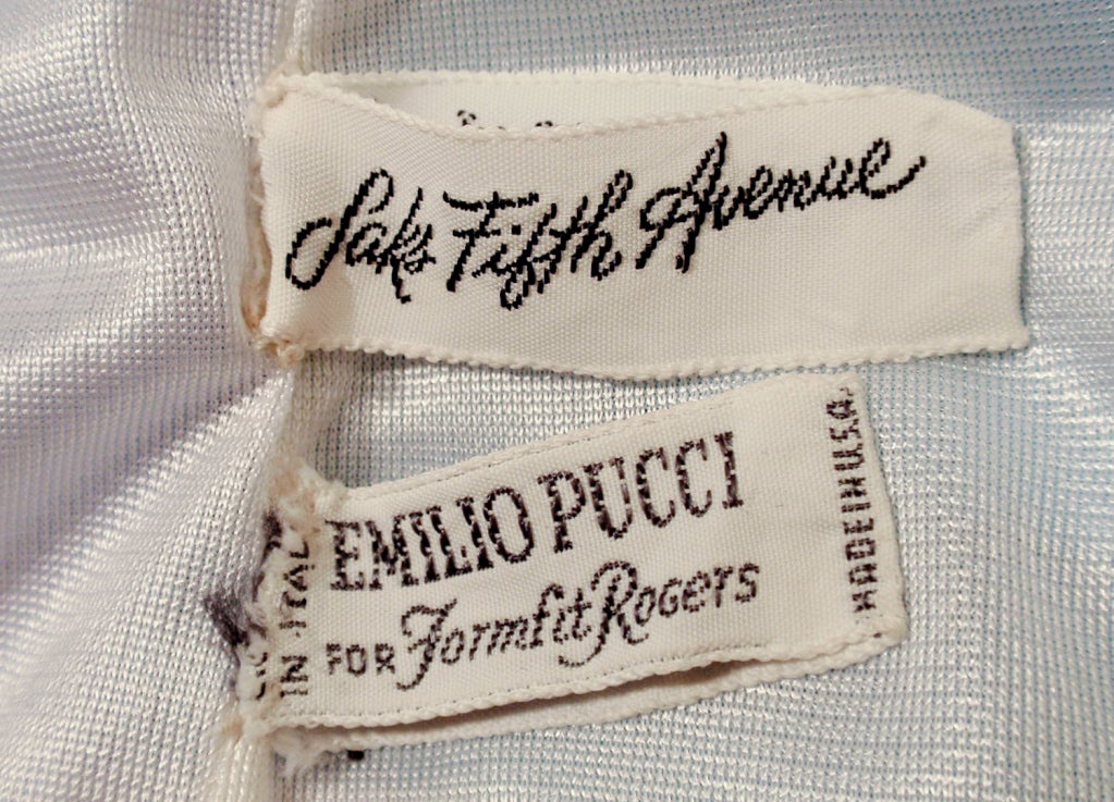 This is a gorgeous vintage nightgown from Emilio Pucci for Formfit Rogers. It is sleeveless and has an empire waist and v-neck front. Very flattering and colorful, it is made of a blue, purple and white print nylon, with a white nylon lining. There
