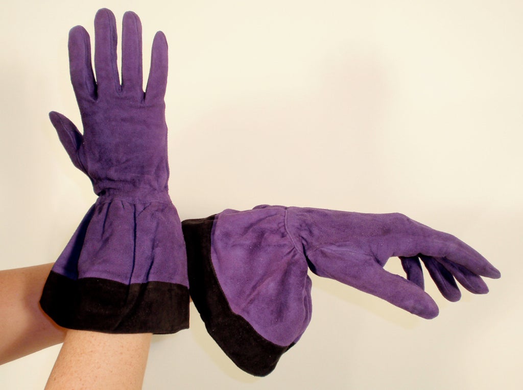 Gauntlet style gloves from Yves saint Laurent Rive Gauche. They are made from purple and black suede, with silk lining.

Measurements:

Length: 13 1/2
