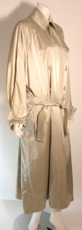 This is a double breasted Alaia trench coat in light moss/mint green color with attached belt.

Measurements:
Length: 53