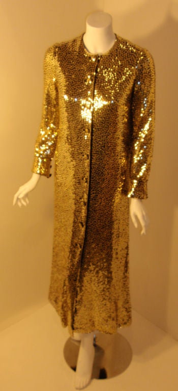Long Norell Gold Sequin Evening Coat. Beautifully crafted. <br />
<br />
Coat Measures:<br />
Length: 51.5
