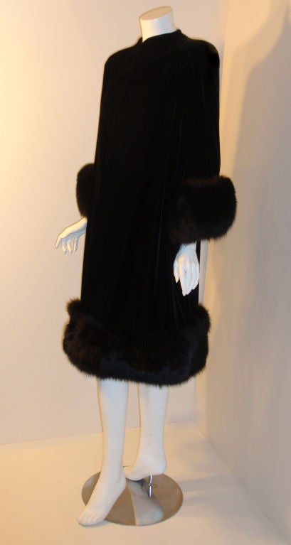 black velvet Opera coat with fox fur trim.  <br />
<br />
Coat Measures:<br />
Length: 41