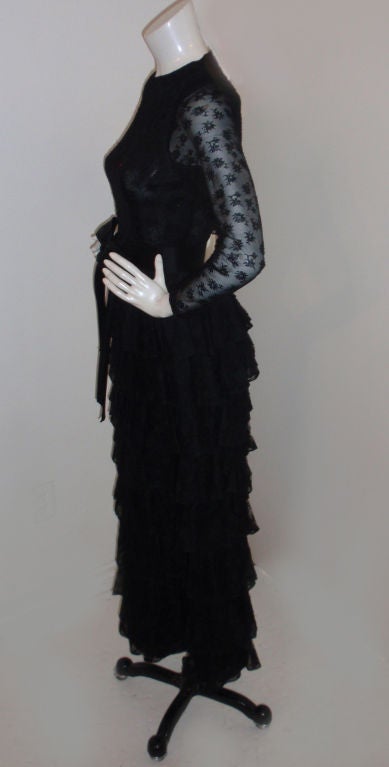 This is a black lace Givenchy couture gown with multiple tiers of fine lace. 

Measurements:

Length: 54