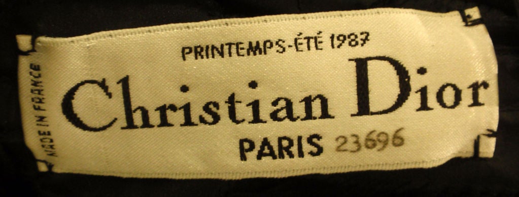 This is a one of a kind black long sleeve chiffon evening gown by Christian Dior Haute Couture, from 1987. The gown has a long train, zipper up the back, and a structured bodice.
Provenance:  Betsy Bloomingdale

Measurements
size: 40 EU,