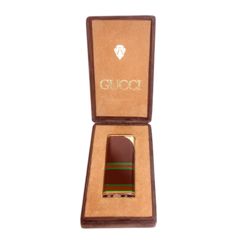 Gucci Vintage Signature Gold Stripped Lighter, Circa 1970