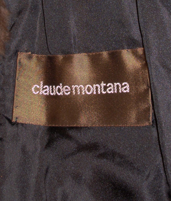 This is a signature style Claude Montana cocoon fur coat. It has a brown mink collar and the body and sleeves are sheared beaver fur. The lining is a black satin. The collar can be worn 3 different ways, with hooks and eyes. There is a leather