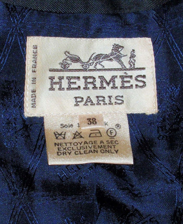 This is an authentic single breasted jacket from Hermes. It has a night sky design with stars and other celestial motifs printed on it in blue and gold. 100% Silk.<br />
<br />
Measurements:<br />
Length(Shoulder to hem):30<br />
Shoulder to