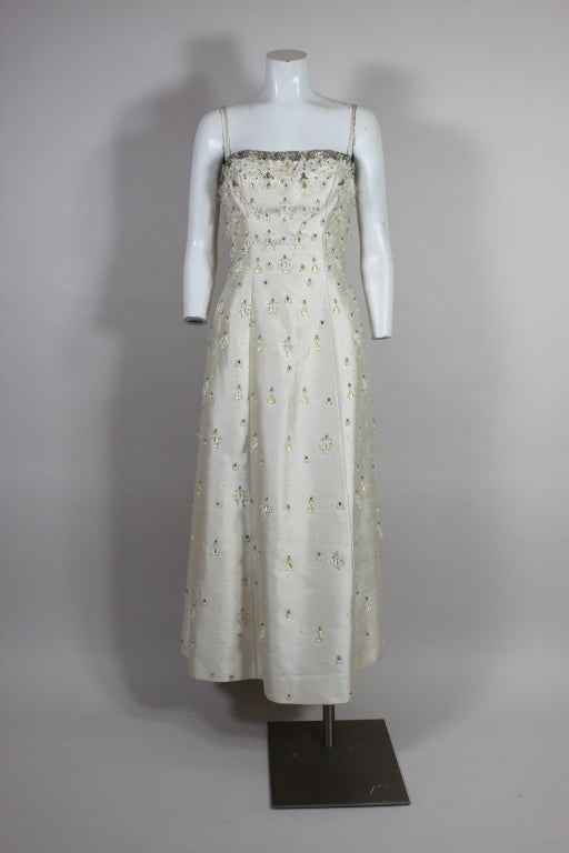 Heavy slubbed silk  gown in ivory embellished generously with crystals, beads and rhinestones.  A gown fit for Grace Kelly!  In pristine condition, perfect for a bride or a ball. A true princess piece.