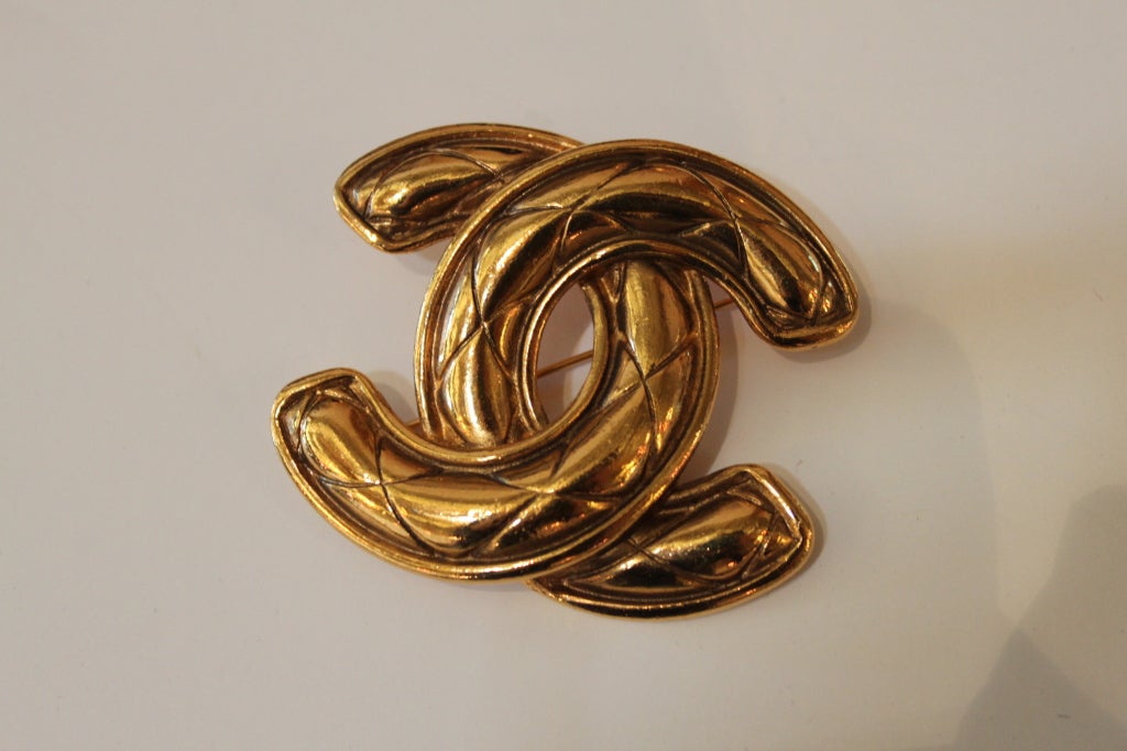 Chanel Quilted Goldtone Monogram Brooch at 1stdibs