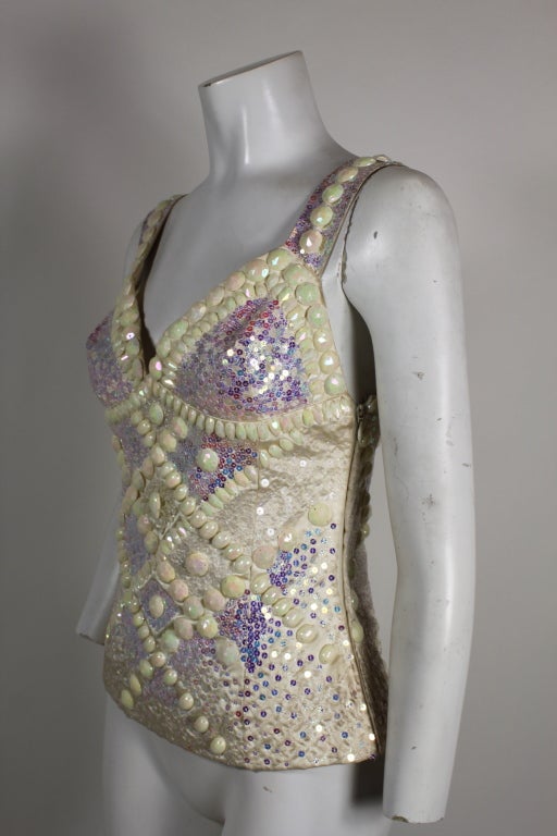 Stunning showgirl-inspired sparkly evening top - perfect with everything from hot pants to a ball skirt. Features iridescent sequins paired with oversized, faceted beads make this piece a stunner. Unlabeled.