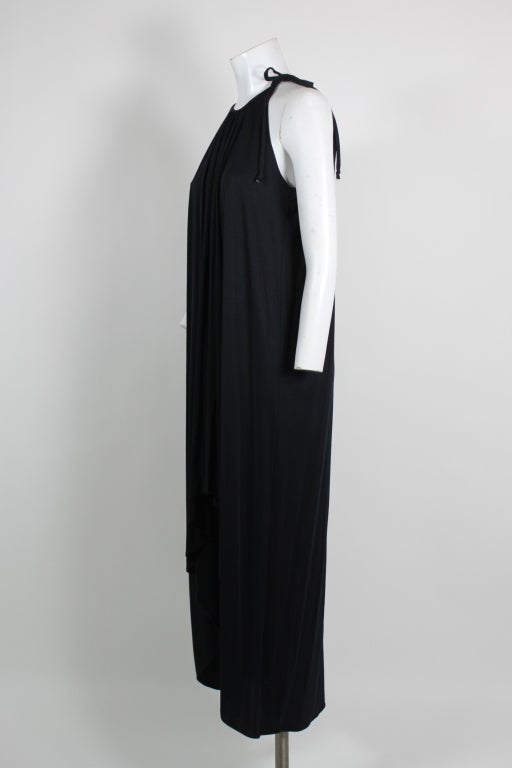 Classic goddess style 1970s black jersey gown.  Perfect California cool elegance.  There is a wonderful weight to the fabric which creates a beautiful drape.  a great piece to dress up or dress down. This dress would fit from a size 2  to a 10 due