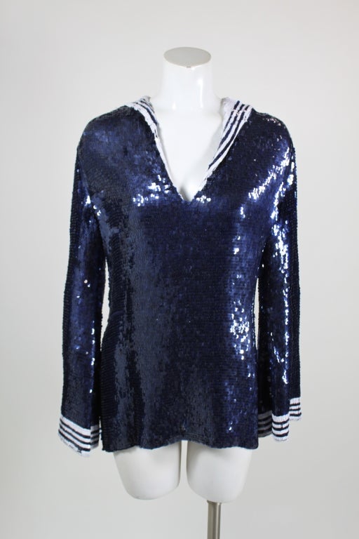 A whimsical sequined sailor tunic from Jean Paul Gaultier. Fully covered in sequins, this is a classic play on Gaultier's love of the uniform silhouette. can be alos be worn as a sexy mini.