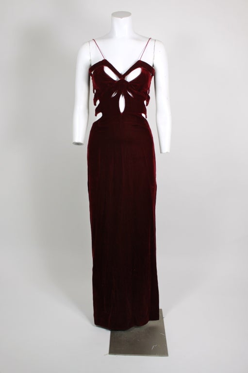 Incredibly sexy 1980s gown in deep blood ret velvet with Mugleresque cut-outs. Corset like top to stand at attention.  Not for the timid!
