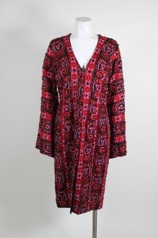 This truly stunning Carolina Herrera coat is hand beaded on striped metallic brocade. Fully lined in black silk.