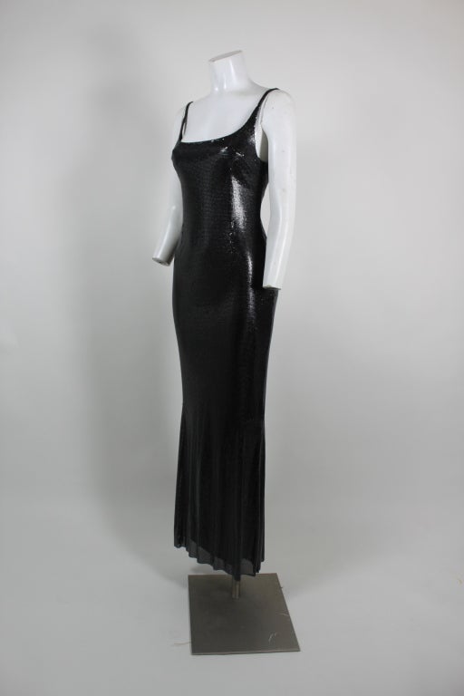 Incredibly sexy Atelier Versace black metal mesh body-hugging gown with slight flounce at hem. Lined in 100% silk.